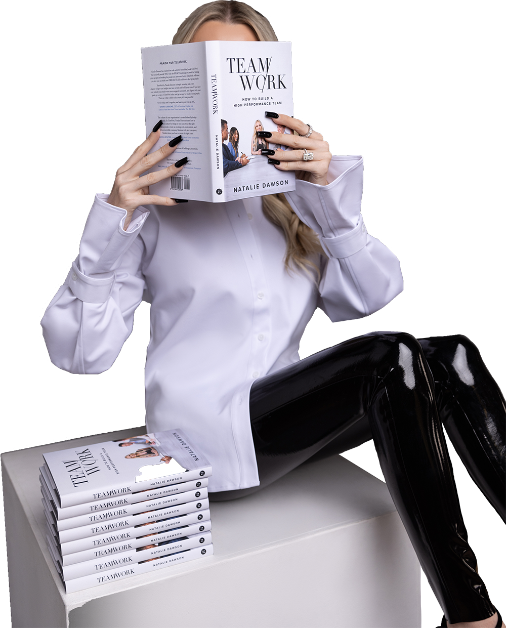 Natalie Dawson sitting and reading her book TEAMWORK